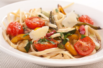  bowl of mediterranean pasta with vegetables and parmesan