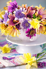 Beautiful bouquet of spring flowers in a vase on the table. Lovely bunch of flowers .Many beautiful fresh flowers on a table. 