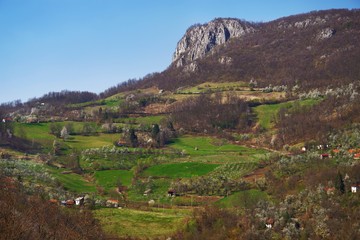 Fototapeta na wymiar Stunning mountain scenery in spring in Europe with many green hills and trees