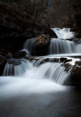 Fototapeta premium Scene with long exposure waterfall in late autumn
