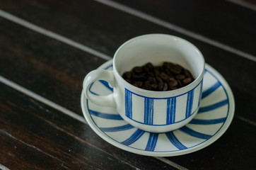 Coffee cup with good quality coffee beans inside 2