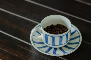 Coffee cup with good quality coffee beans inside 3