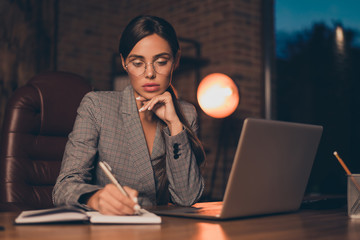 Close up photo beautiful she her business lady chief got promotion work day night first startup get some mistakes moments write down sit big office chair wear specs formal wear checkered plaid suit