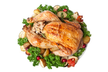 whole roasted stuffed chicken with parsley, vegetables and cranberries