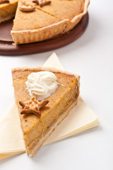 slice of pumpkin pie with whipped cream