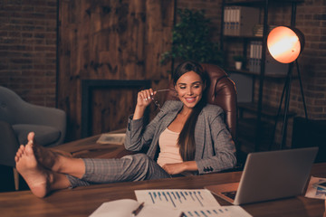 Close up side profile photo beautiful she her business lady chief hard week weekend speak skype legs table look satisfied notebook overjoyed sit office chair wear specs formal wear checkered suit