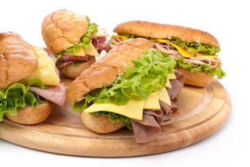 group of tasty ham, salami, turkey and beef sandwiches