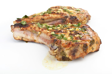 Two Mexican Citrus Pork Chops isolated on white
