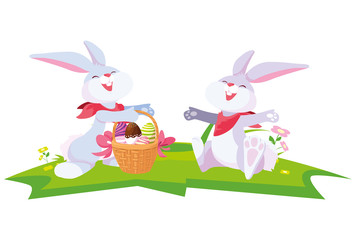 cute rabbits couple with eggs painted in basket