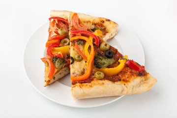 Two slices of vegetable pizza on white background