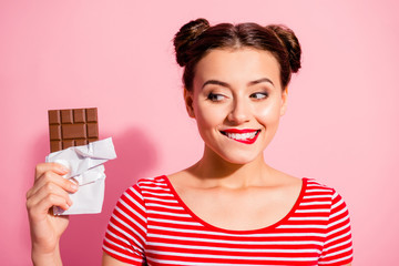 Close-up portrait of nice cute charming attractive winsome glamorous cheerful girl wearing striped t-shirt holding in hands looking favorite dessert life lifestyle advert isolated on pink background