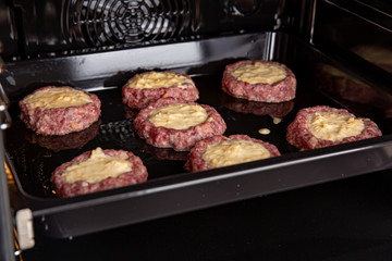 Fresh hot veal cutlet in fillo dough in the oven