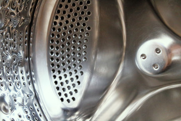 Washing machine drum inside. Close-up. Background. Texture.