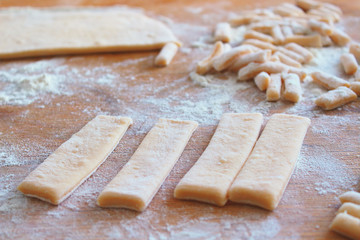 Sliced dough on a wooden board. Close-up. Background. Texture.