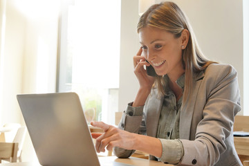 Saleswoman preparing sales pitch on work trip