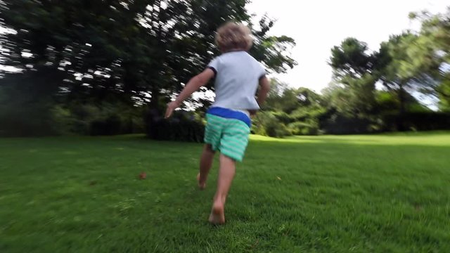 Toddler Boy Running Outside