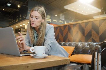 Saleswoman preparing sales pitch on work trip