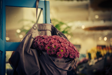 violet flowers in bag