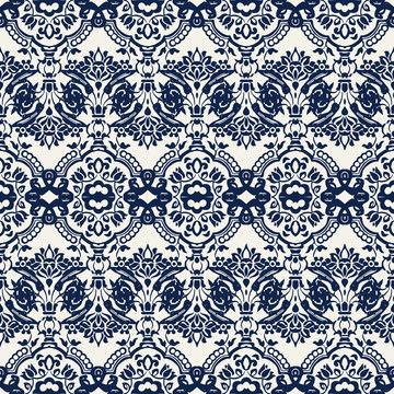 Indigo dye woodblock printed seamless ethnic floral damask pattern. Traditional oriental ornament of India with exotic flowers of Kashmir, navy blue on ecru background. Textile design.