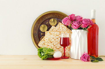 Pesah celebration concept (jewish Passover holiday) over wooden table