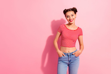 Portrait of her she nice-looking cute charming attractive lovely winsome cheerful cheery content girl wearing striped t-shirt jeans isolated on pink pastel background
