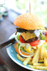 Beef hamburger fastfood on wooden table