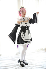 Portrait of Japan anime cosplay woman , white japanese maid in white tone room