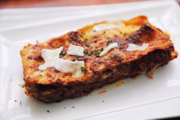 Beef lasagna on wooden background , Italian food