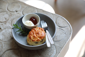 Scones with cream and strawberry jam