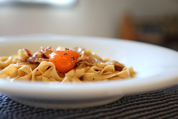 Homemade pasta with white sauce , spaghetti carbonara , italian food