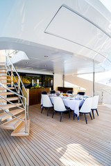 Big yacht deck with served table