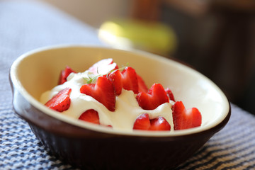Strawberry with cream on table dessert