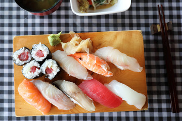 Sushi Set nigiri and sushi maki with tea served on wood and soup , Japanese food
