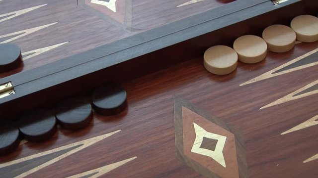 Rolling two dice on a Backgammon setting, the dice coming up as a 4 and a 6. Set of four different rolls.
