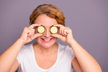 Close up photo beautiful amazing mature she her lady salon spa procedures cucumber slices on eyes nature treatment ideal condition without under eyes bags wear white t-shirt isolated grey background
