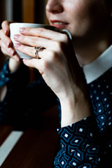 beautiful girl in a coffee shop at breakfast