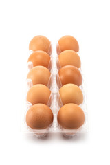 Ten eggs in side the open plastic packaging isolated on white background