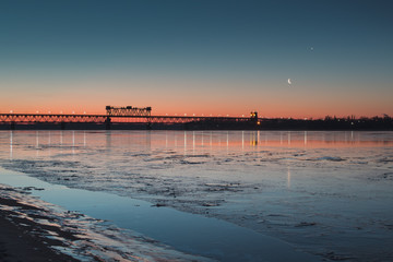 Naklejka premium Early morning on the river coast. New moon.