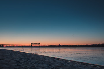 Obraz premium Early morning on the river coast. New moon.