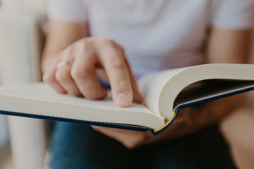 Young man reading a book