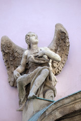 Angel statue on the facade of the Saint Francis church in Budapest, Hungary