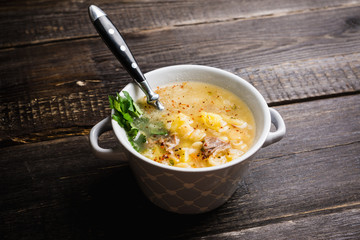 Fat meat soup with lamb based broth, chickpea and potatoes. Selective focus.