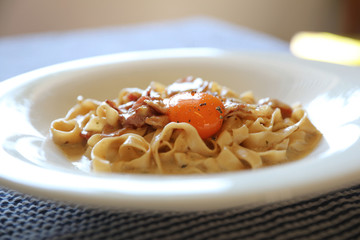 Homemade pasta with white sauce , spaghetti carbonara , italian food