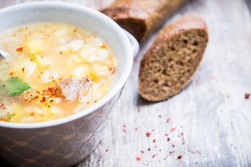 Fat meat soup with lamb based broth, chickpea and potatoes. Selective focus.