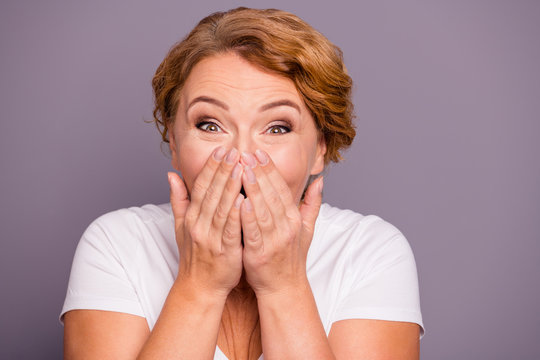Close-up portrait of her she nice attractive winsome cheerful cheery positive wavy-haired lady in casual white t-shirt closing face palms isolated on gray violet purple pastel background
