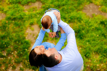Beautiful familly posing in park
