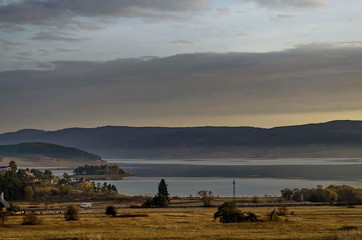 Obraz premium Batak dam with rest homes at the Rodopi mountain Bulgaria