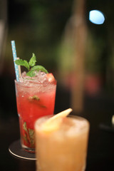 Red cocktail at bar