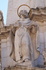 Statue of Saint Augustine of Hippo, detail of Holy Trinity plague column in front of Matthias...