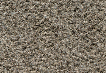 Grey and brownish granite wall with quarts as background
